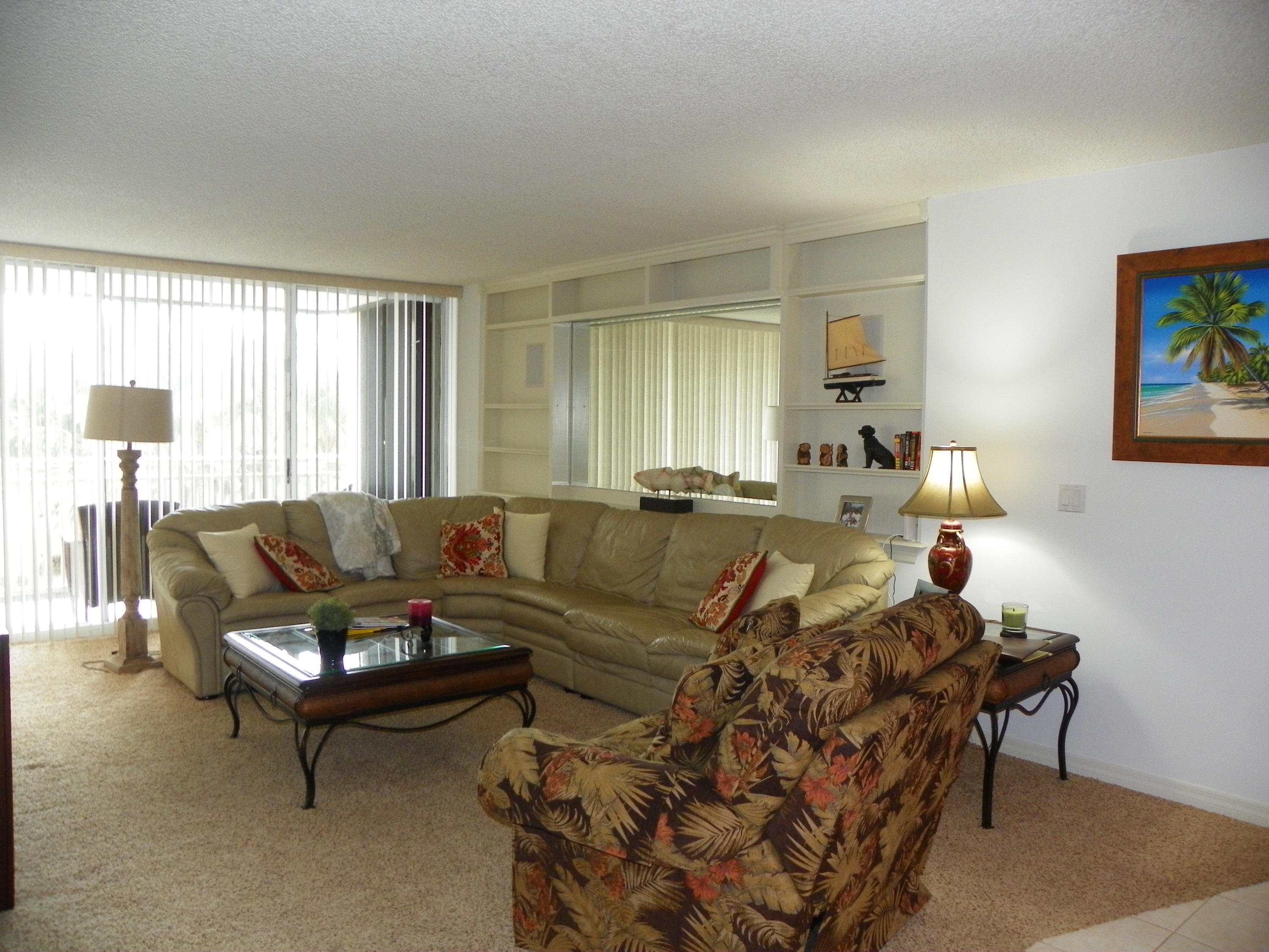 3400 North Ocean Drive, Unit 306 Riviera Beach, FL 33404 - Photo 7 of 52 a living room with furniture and a potted plant