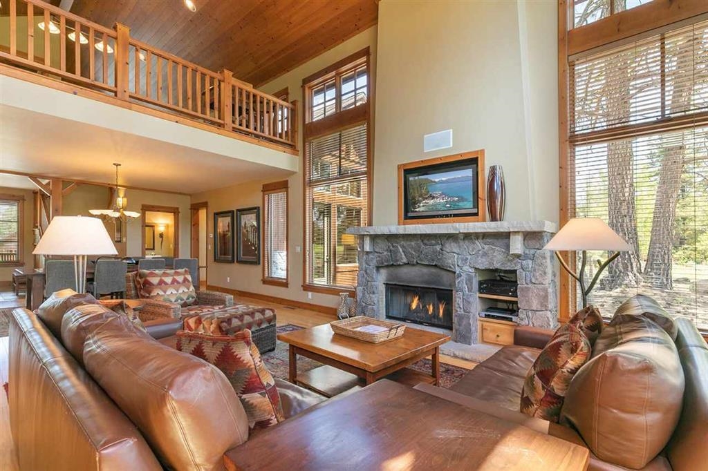 12445 Lookout Loop, Unit F1605 Truckee, CA 96161 - Photo 7 of 21 a living room with furniture a fireplace and a large window