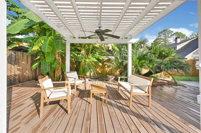 a view of a balcony with floor to ceiling windows and wooden floor