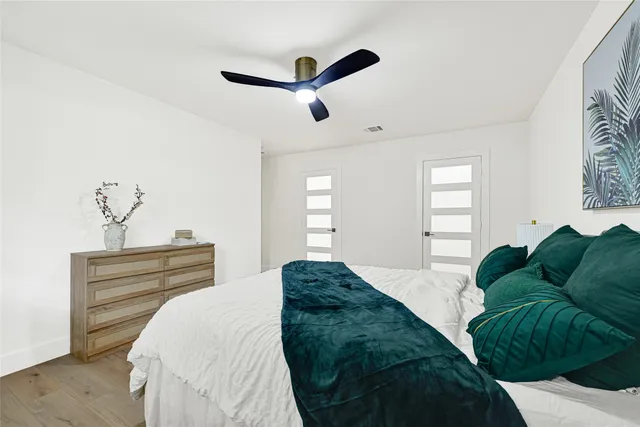 a bedroom with a bed and window