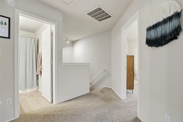 a view of a livingroom from a hallway