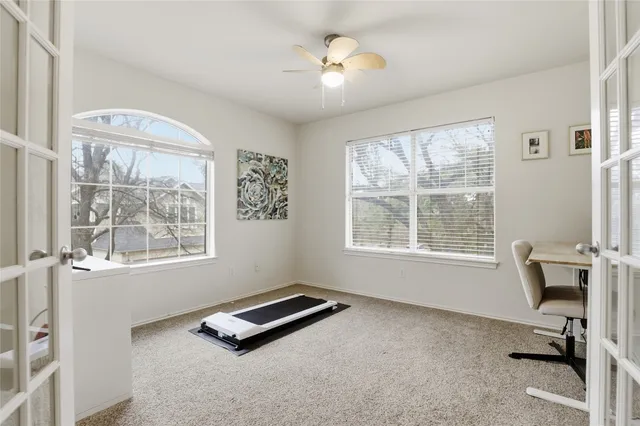 a room with gym equipment and a window
