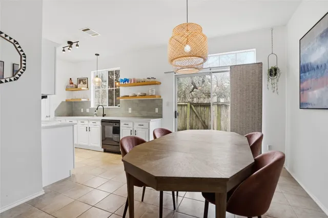 a view of a dining room with furniture window and outside view