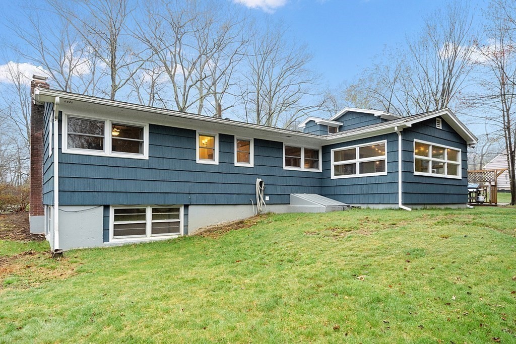 1016 George Hill Road Lancaster, MA 01523 - Photo 36 of 41 front view of a house with a yard