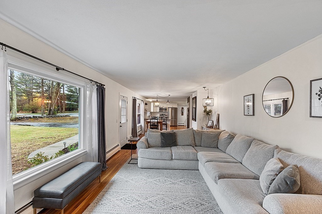 1016 George Hill Road Lancaster, MA 01523 - Photo 8 of 41 a living room with furniture and a large window