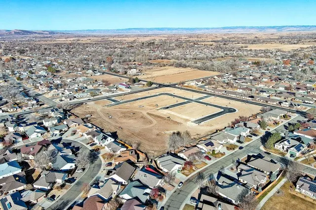 an aerial view of residential building with ocean view