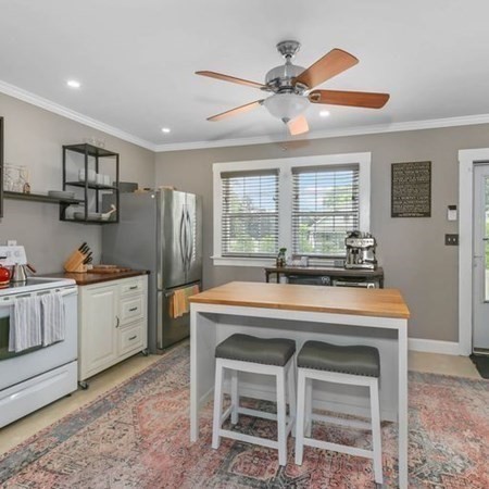 2342 Main Street Three Rivers, MA 01080 - Photo 6 of 41 a kitchen with kitchen island a stove a sink and a refrigerator