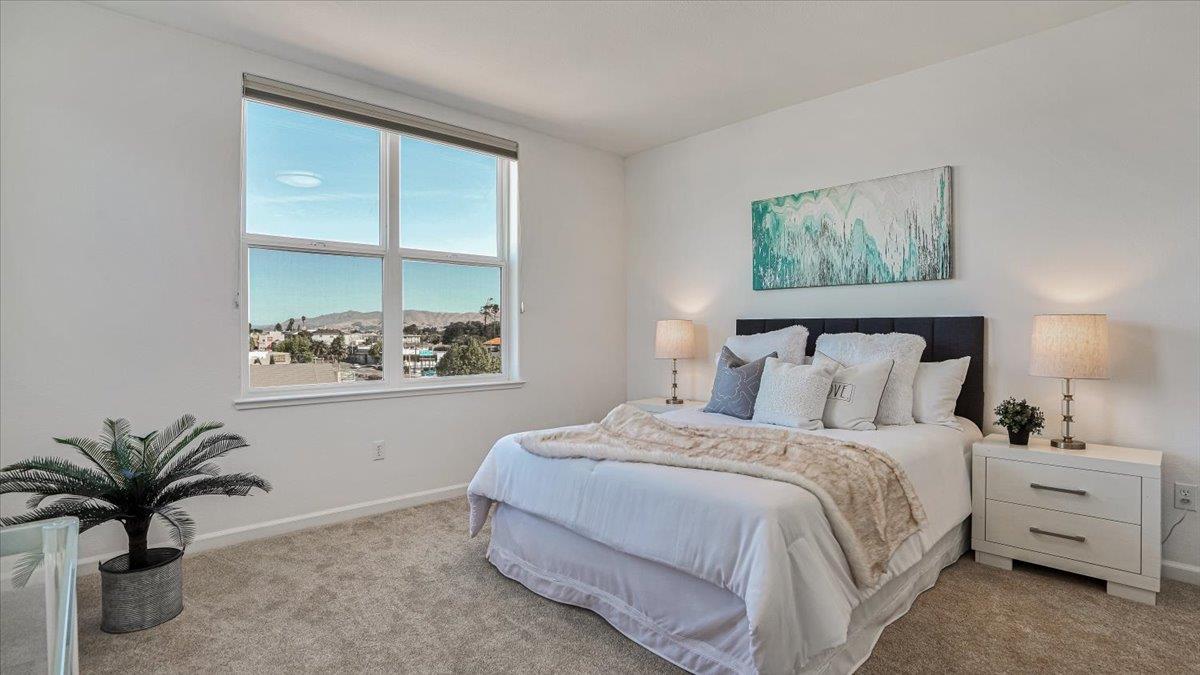 1388 Broadway, Unit 407 Millbrae, CA 94030 - Photo 14 of 28 a bedroom with a bed and a window