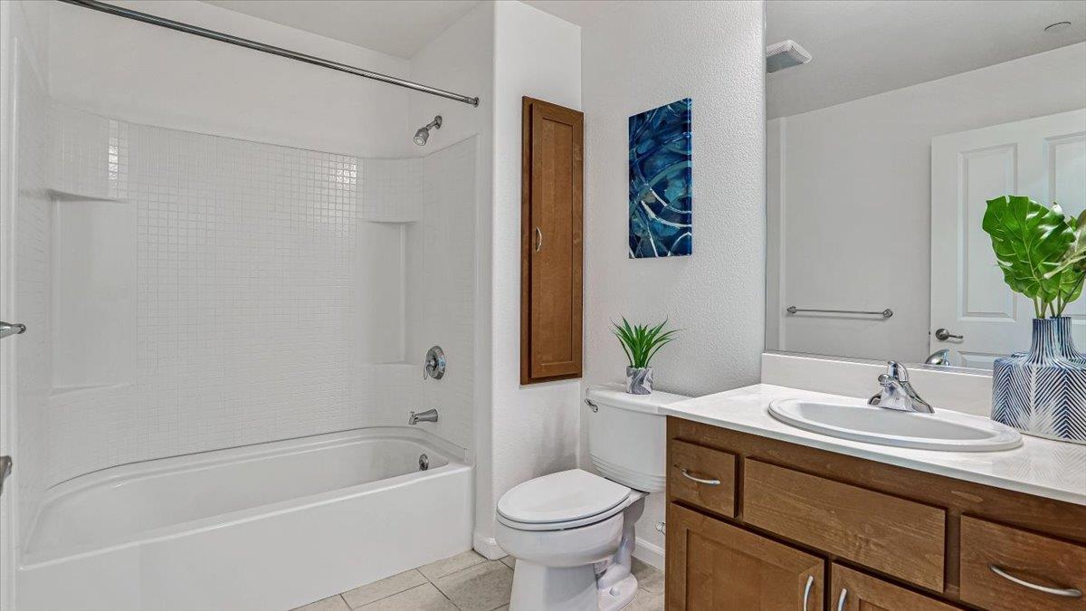 1388 Broadway, Unit 407 Millbrae, CA 94030 - Photo 17 of 28 a bathroom with a sink toilet and shower