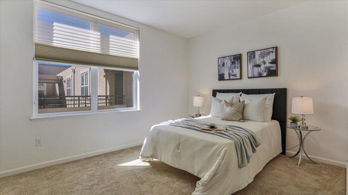 1388 Broadway, Unit 407 Millbrae, CA 94030 - Photo 18 of 28 a bedroom with a bed and a window
