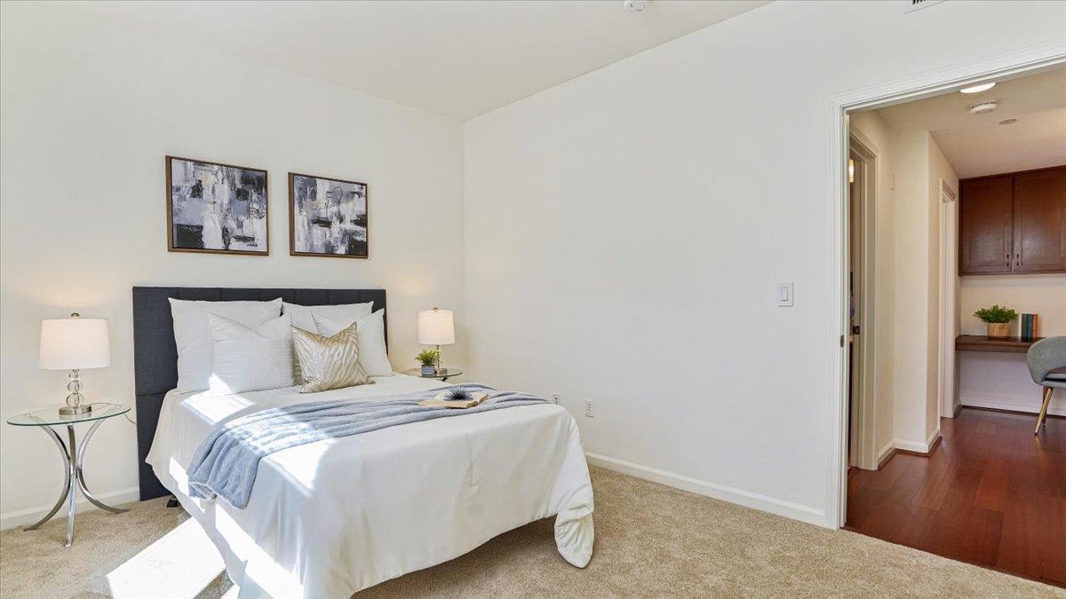 1388 Broadway, Unit 407 Millbrae, CA 94030 - Photo 20 of 28 a bedroom with a bed and a view of painting