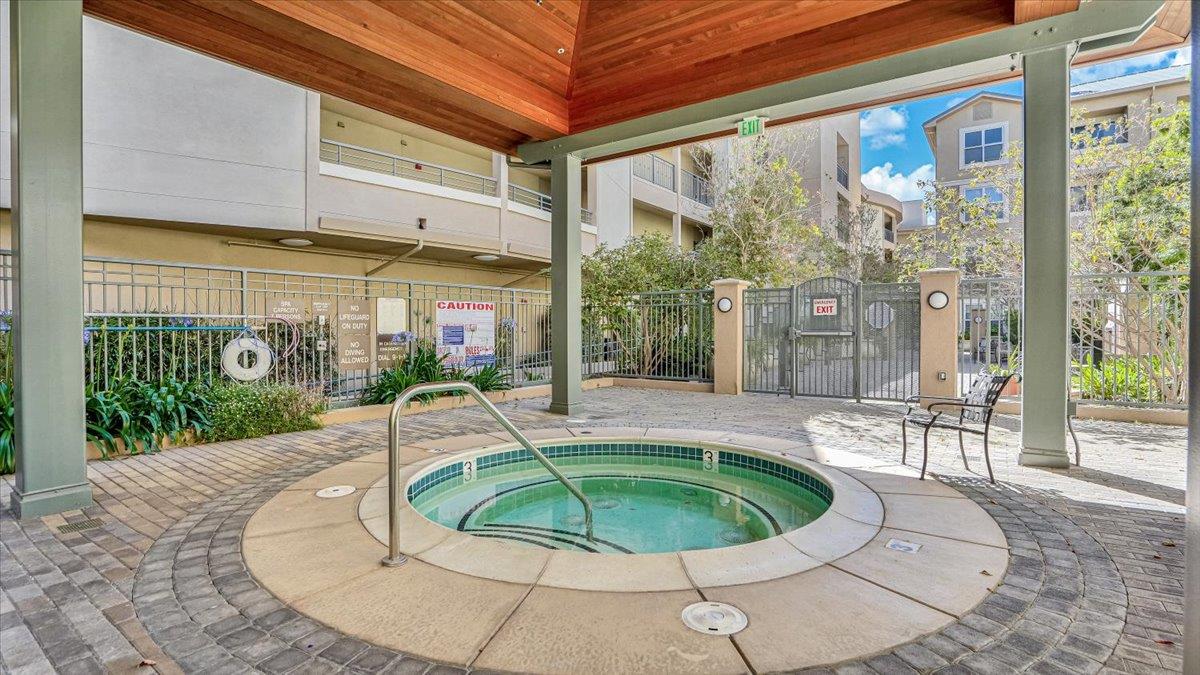 1388 Broadway, Unit 407 Millbrae, CA 94030 - Photo 25 of 28 a view of a swimming pool with a patio