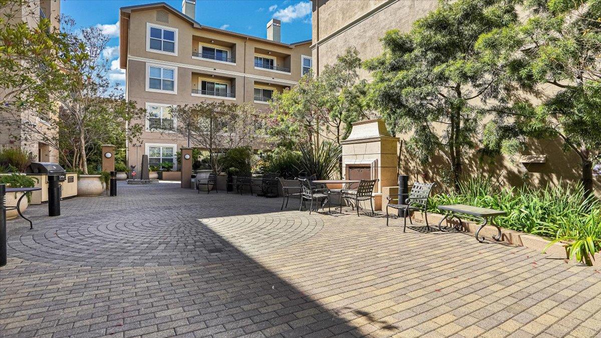 1388 Broadway, Unit 407 Millbrae, CA 94030 - Photo 26 of 28 a building with trees in front of it