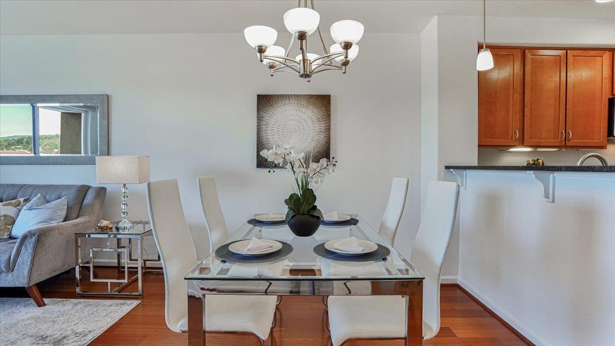 1388 Broadway, Unit 407 Millbrae, CA 94030 - Photo 8 of 28 a view of a dining room with furniture and wooden floor