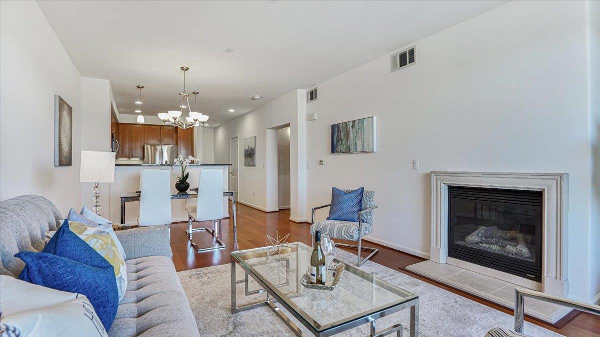 1388 Broadway, Unit 407 Millbrae, CA 94030 - Photo 9 of 28 a living room with furniture and a fireplace