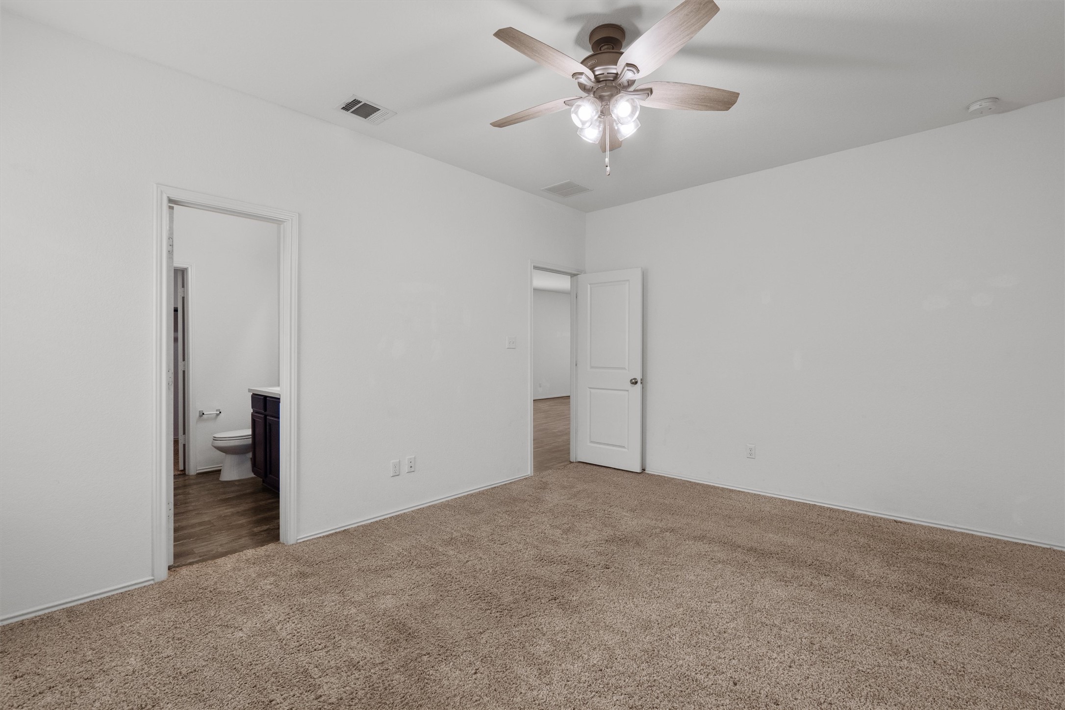 791 Circle Way Jarrell, TX 76537 - Photo 17 of 36 Carpeted room featuring a ceiling fan with integrated lighting, white walls, and a white two-panel door