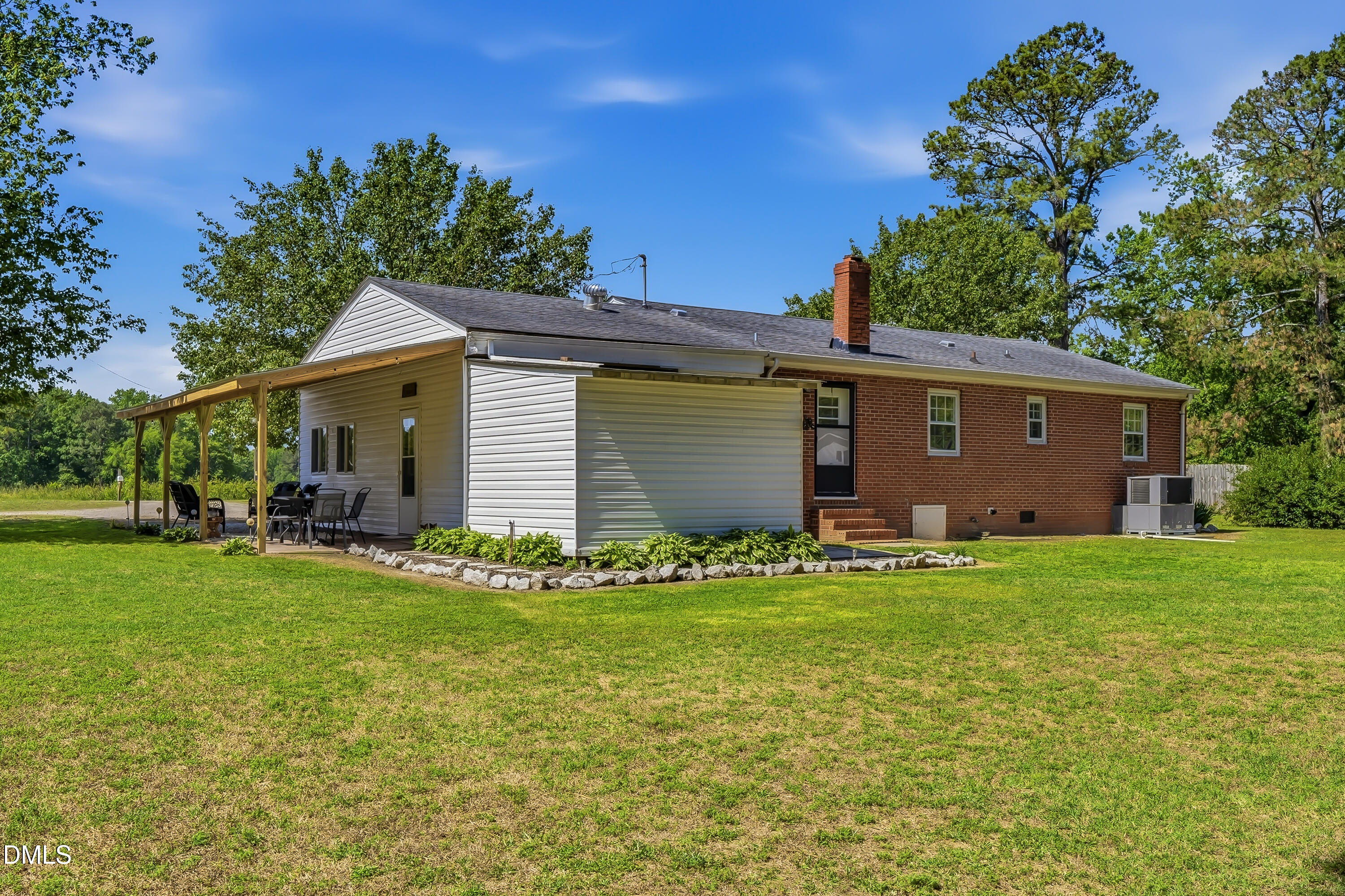 4967 Highway 581 Spring Hope, NC 27882 - Photo 11 of 44 a view of a backyard with a garden