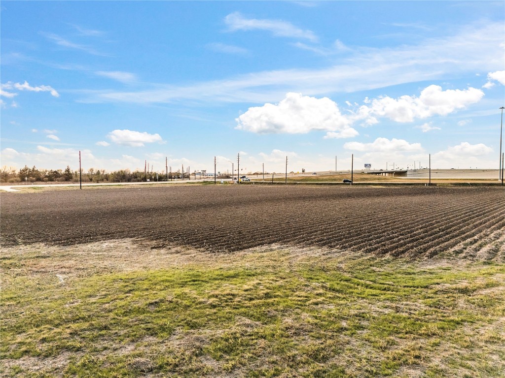 0 Hartledge Road Rosenberg, TX 77471 - Photo 11 of 13 Expansive plot of land with open views, located near a highway. Ideal for development or agricultural use, offering convenient access and potential.