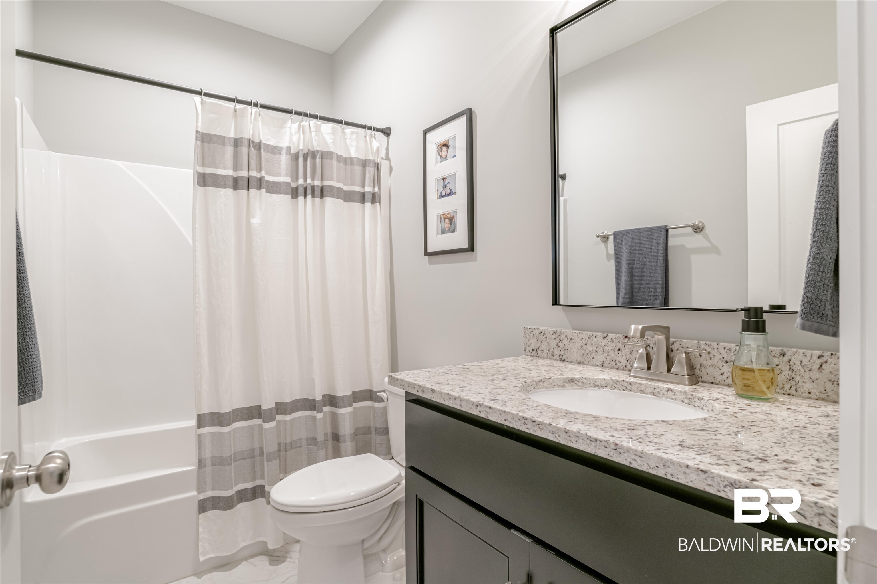 655 H Norman Lane Fairhope, AL 36532 - Photo 23 of 30 Full bathroom with vanity, toilet, and shower / bathtub combination