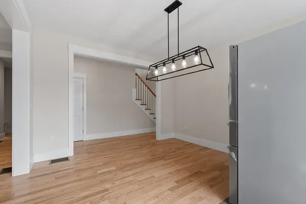 a view of a storage & utility room with wooden floor