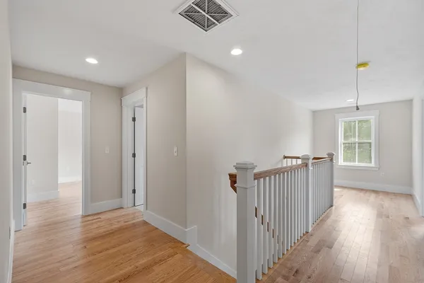a view of entryway with wooden floor