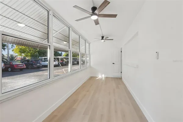 a view of a big room with closet and windows