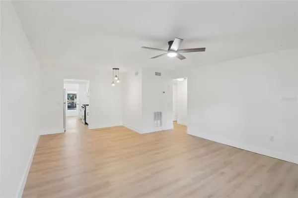 a kitchen with stainless steel appliances a sink stove and refrigerator