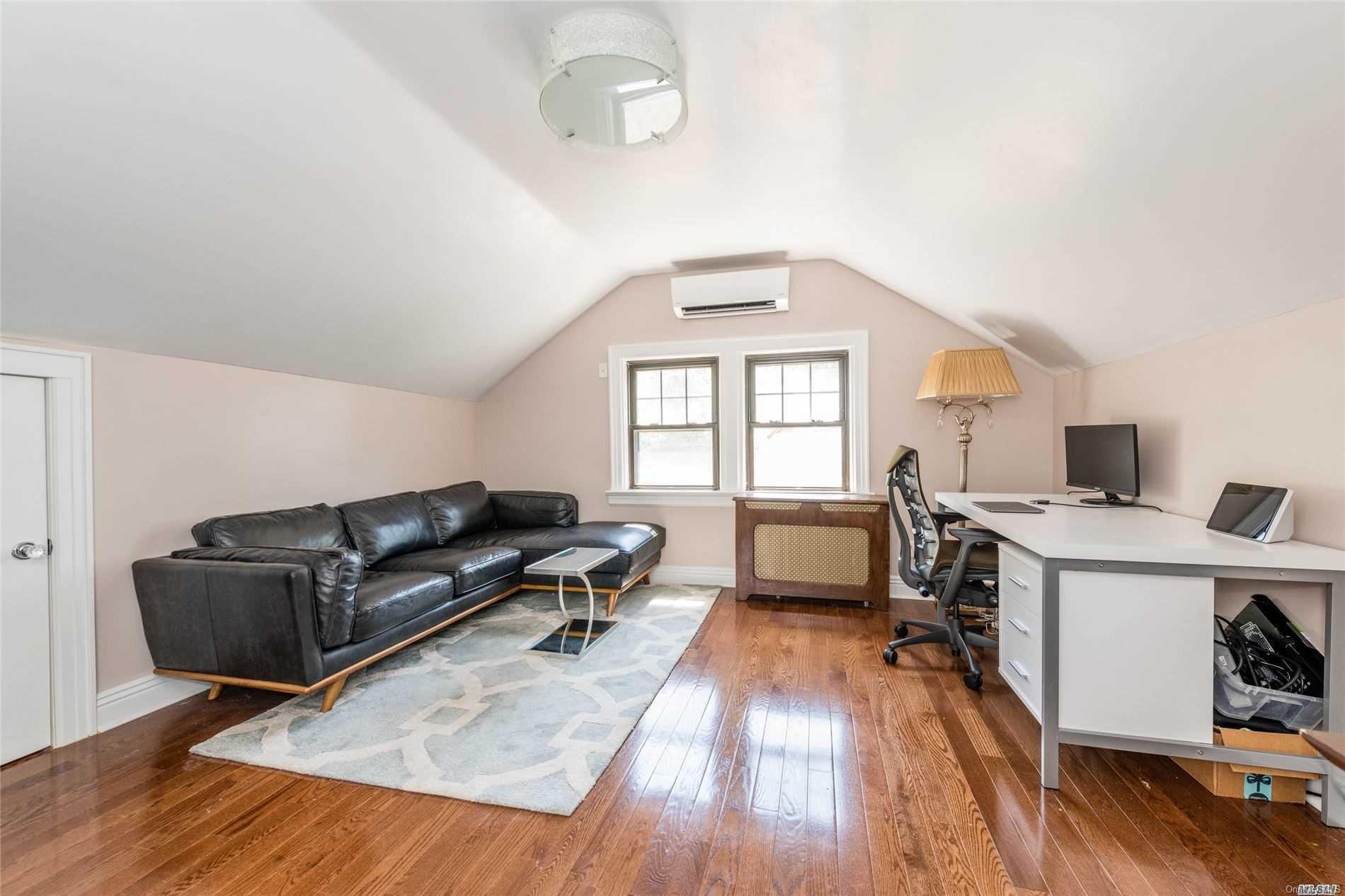 85-36 Wareham Place Queens, NY 11432 - Photo 18 of 26 a living room with furniture window and wooden floor