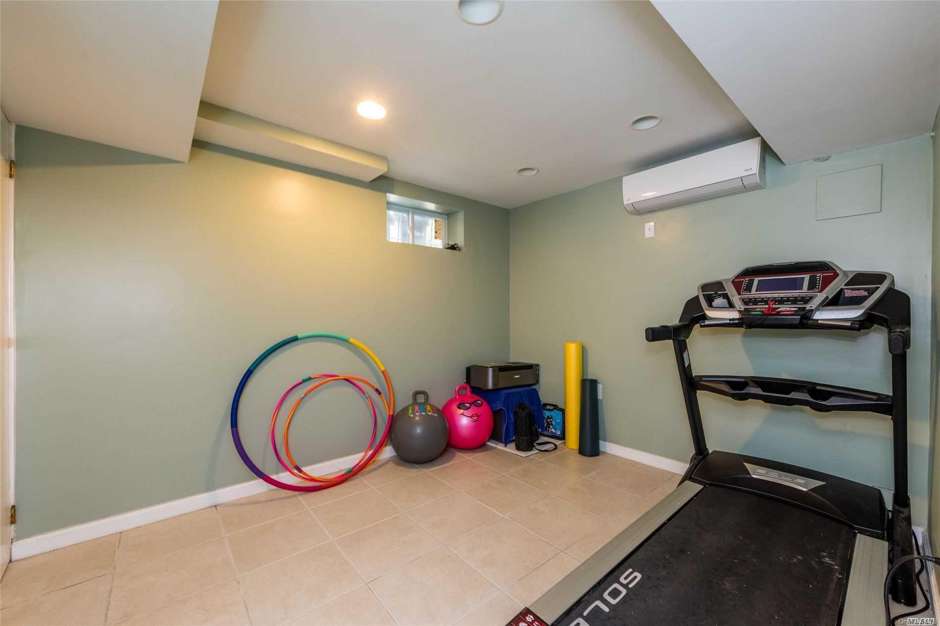 85-36 Wareham Place Queens, NY 11432 - Photo 19 of 26 a room with furniture and air hockey table