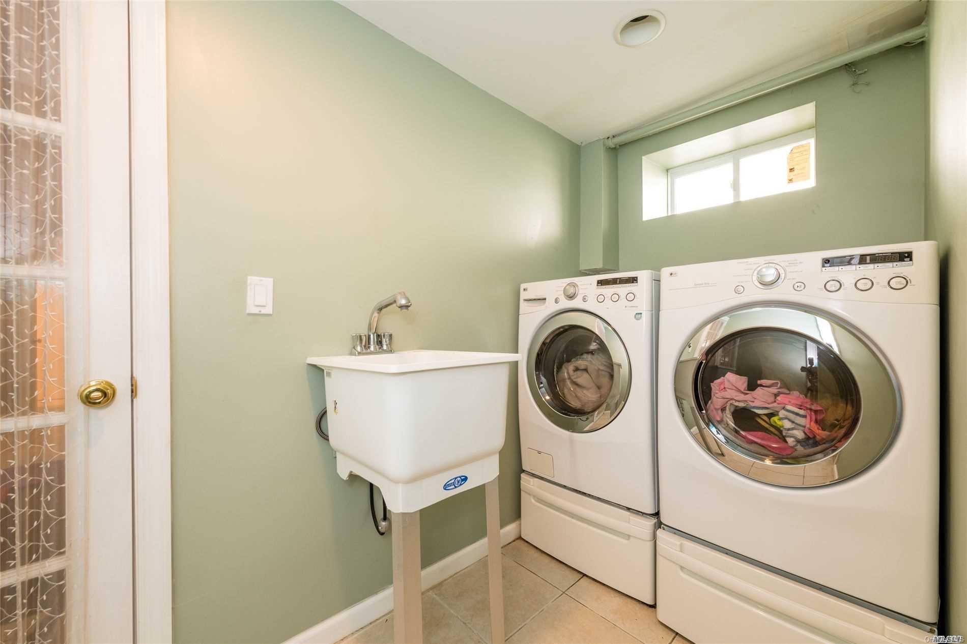 85-36 Wareham Place Queens, NY 11432 - Photo 20 of 26 a utility room with dryer and washer