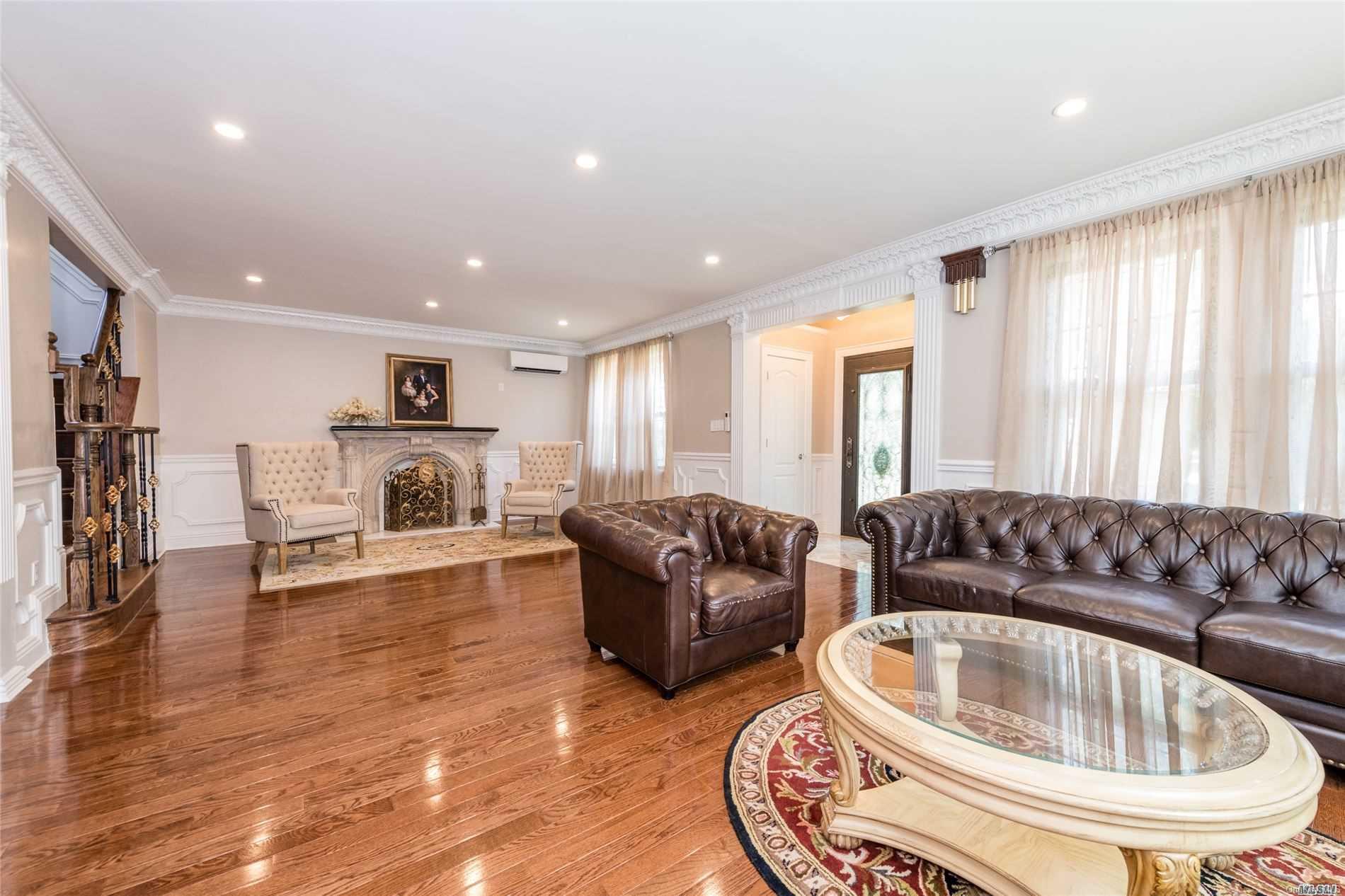 85-36 Wareham Place Queens, NY 11432 - Photo 2 of 26 a living room with furniture and a fireplace