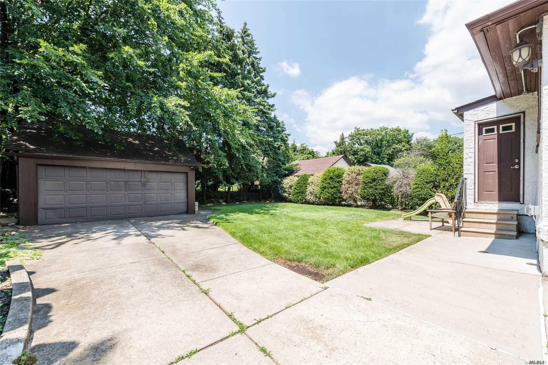 85-36 Wareham Place Queens, NY 11432 - Photo 23 of 26 a view of backyard and garage