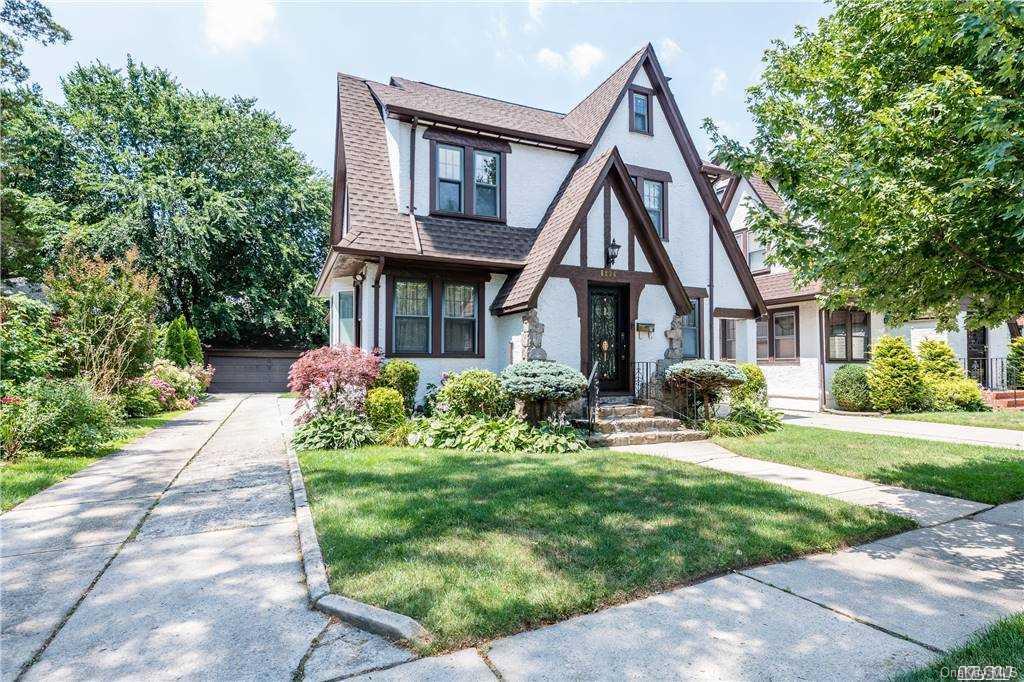 85-36 Wareham Place Queens, NY 11432 - Photo 24 of 26 a front view of a house with a yard