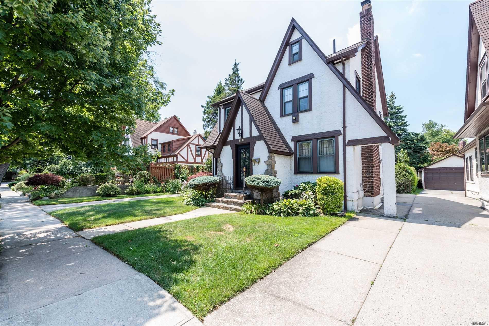 85-36 Wareham Place Queens, NY 11432 - Photo 25 of 26 a front view of a house with a yard