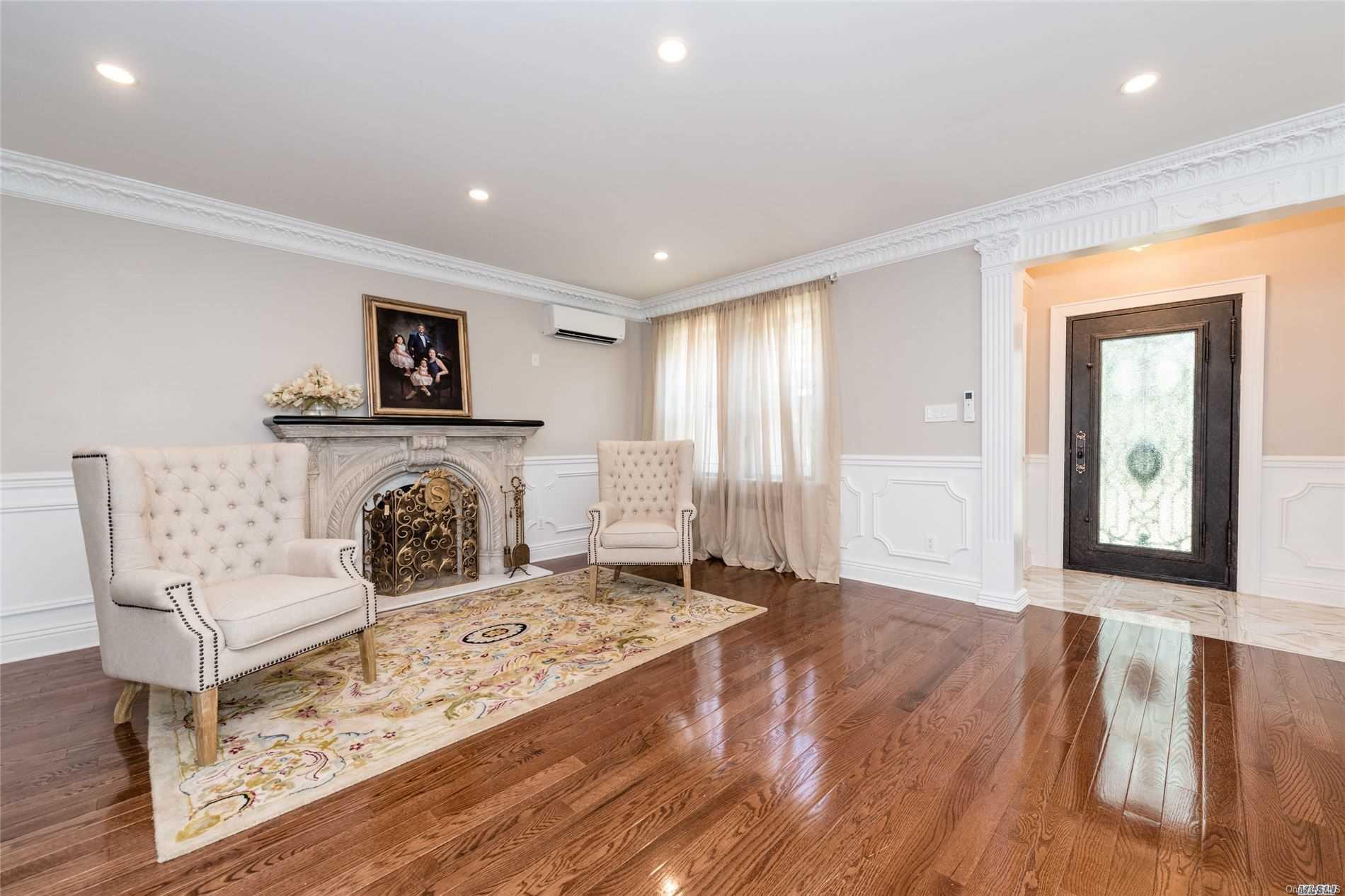 85-36 Wareham Place Queens, NY 11432 - Photo 3 of 26 a living room with furniture and a fireplace
