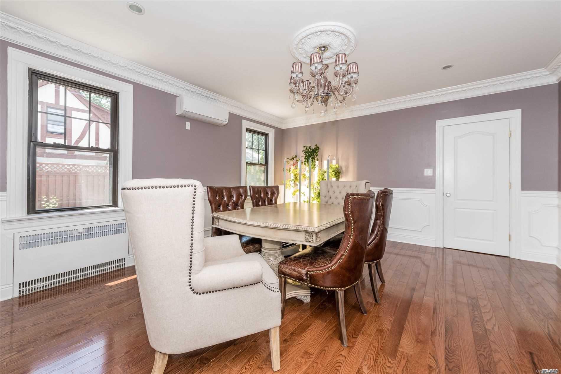 85-36 Wareham Place Queens, NY 11432 - Photo 6 of 26 a view of a dining room with furniture window and wooden floor
