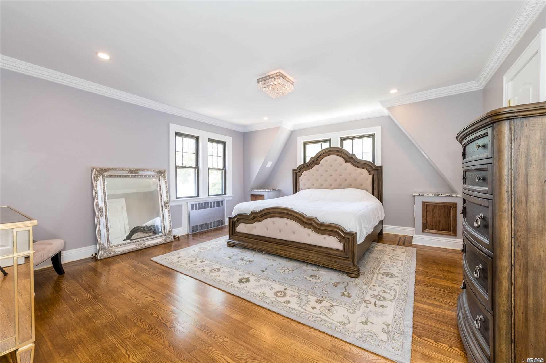 85-36 Wareham Place Queens, NY 11432 - Photo 10 of 26 a bedroom with a bed and a window