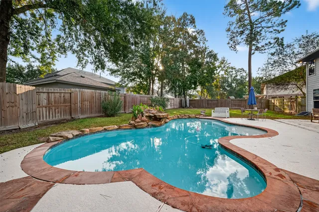 a view of a swimming pool with a patio