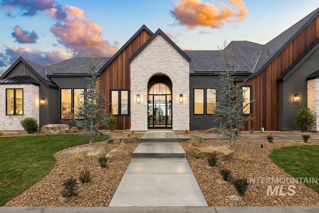 494 Century Avenue Middleton, ID 83644 - Photo 3 of 50 View of front of property featuring stone siding, a shingled roof, and a front yard