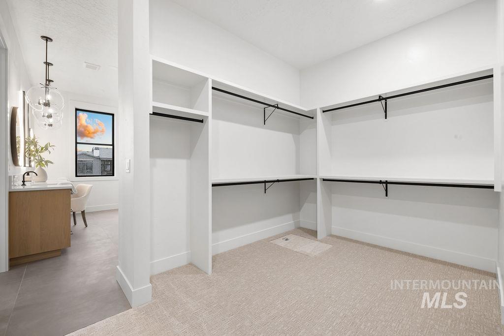 494 Century Avenue Middleton, ID 83644 - Photo 35 of 50 Walk in closet with a chandelier
