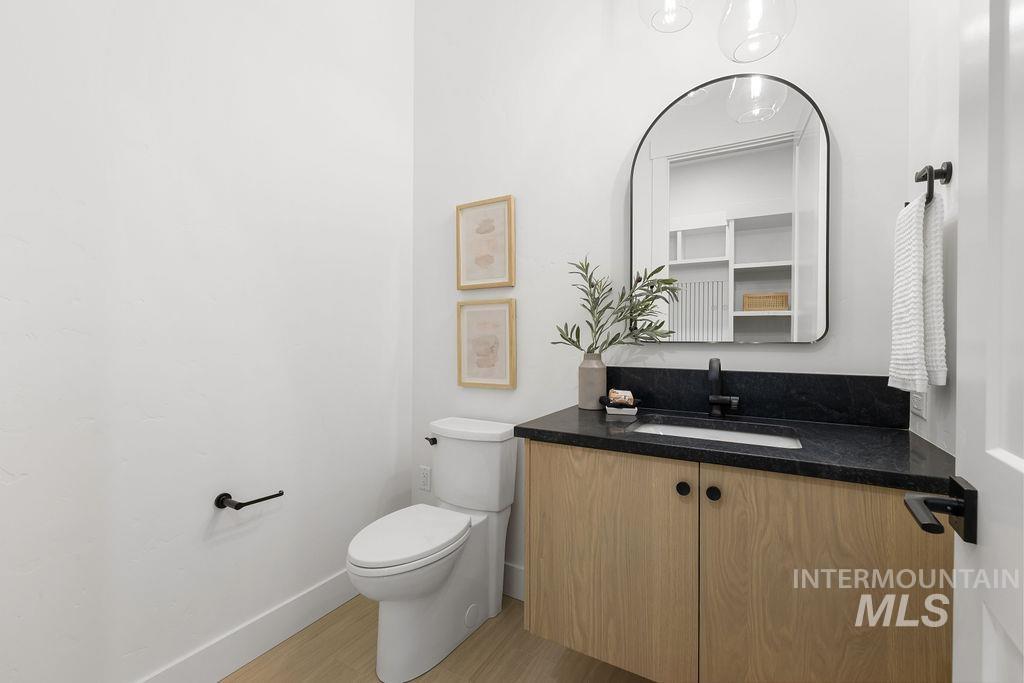494 Century Avenue Middleton, ID 83644 - Photo 37 of 50 Half bathroom with vanity and light wood finished floors