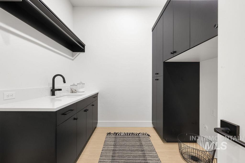 494 Century Avenue Middleton, ID 83644 - Photo 46 of 50 Laundry area with light wood-style floors