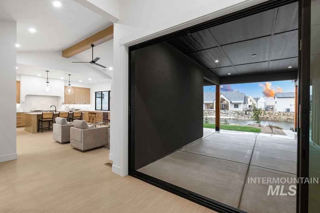 494 Century Avenue Middleton, ID 83644 - Photo 7 of 50 Doorway featuring a water view, recessed lighting, wood finished floors, a residential view, and ceiling fan