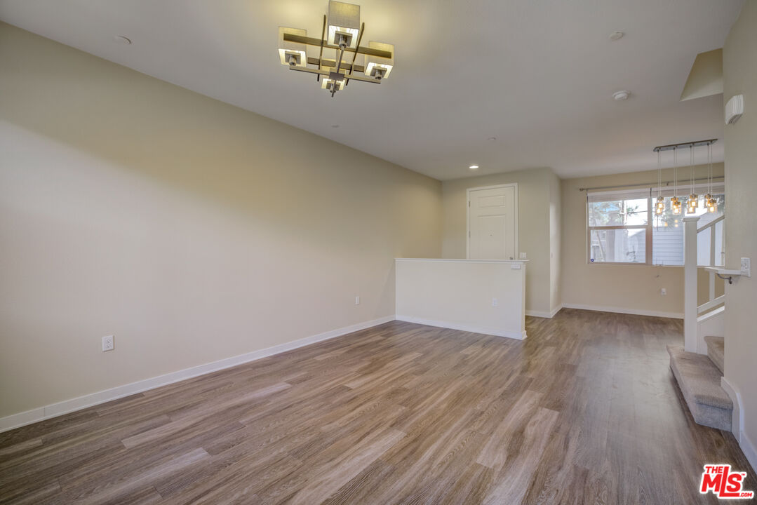 694 Colorado Circle Carson, CA 90745 - Photo 11 of 37 wooden floor in an empty room with a window