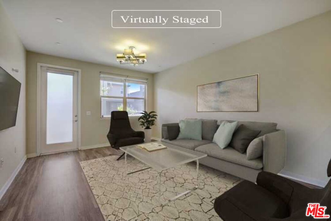 694 Colorado Circle Carson, CA 90745 - Photo 2 of 37 a living room with furniture and a flat screen tv