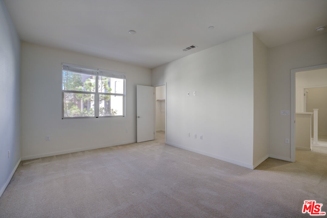 694 Colorado Circle Carson, CA 90745 - Photo 22 of 37 an empty room with windows