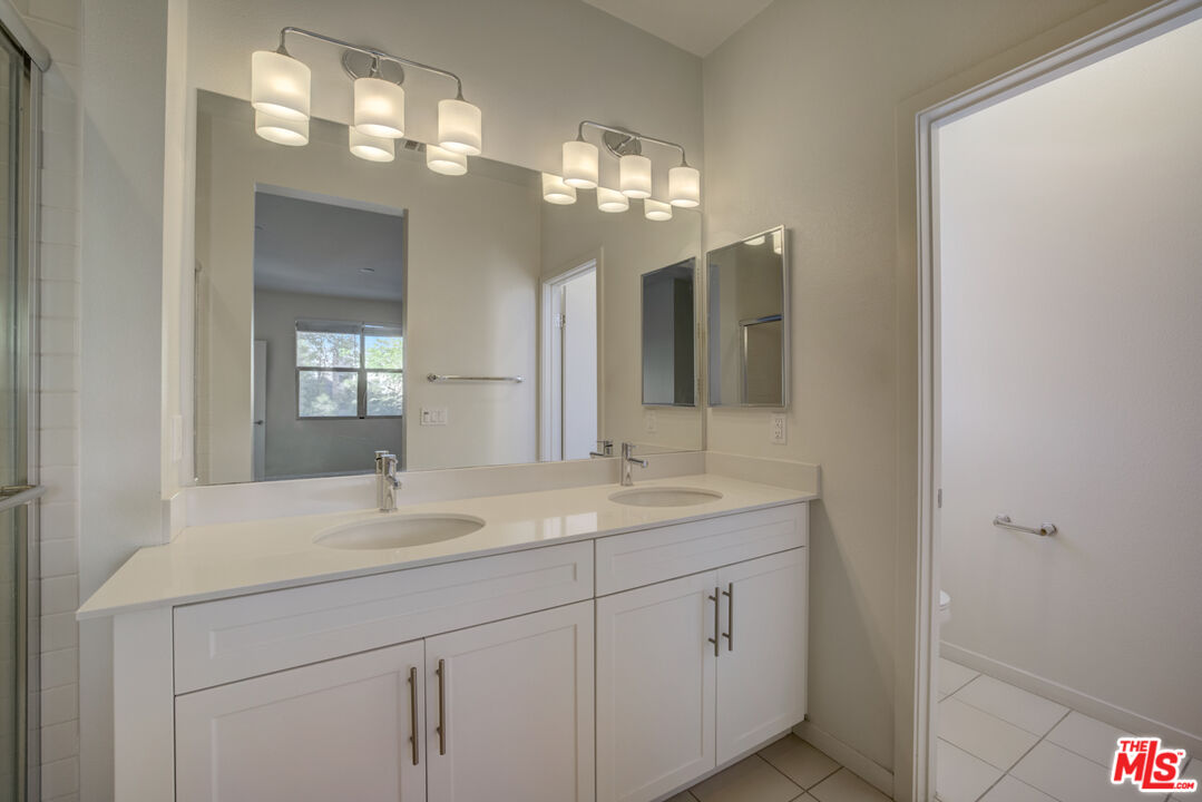694 Colorado Circle Carson, CA 90745 - Photo 23 of 37 a bathroom with a sink and a mirror