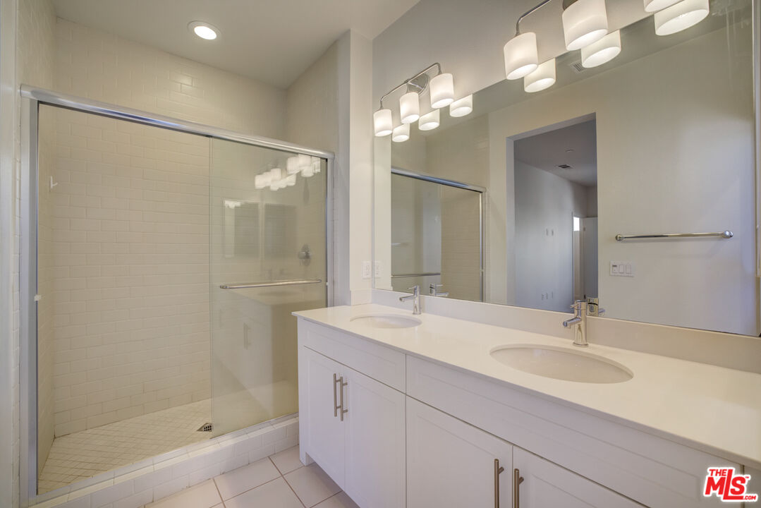 694 Colorado Circle Carson, CA 90745 - Photo 8 of 37 a bathroom with a sink shower and a mirror