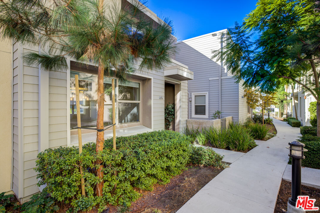694 Colorado Circle Carson, CA 90745 - Photo 9 of 37 a front view of a house with garden
