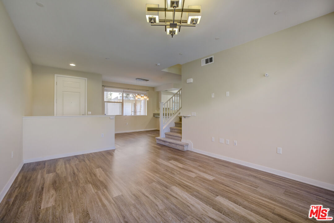 694 Colorado Circle Carson, CA 90745 - Photo 10 of 37 a view of livingroom with hardwood floor and window
